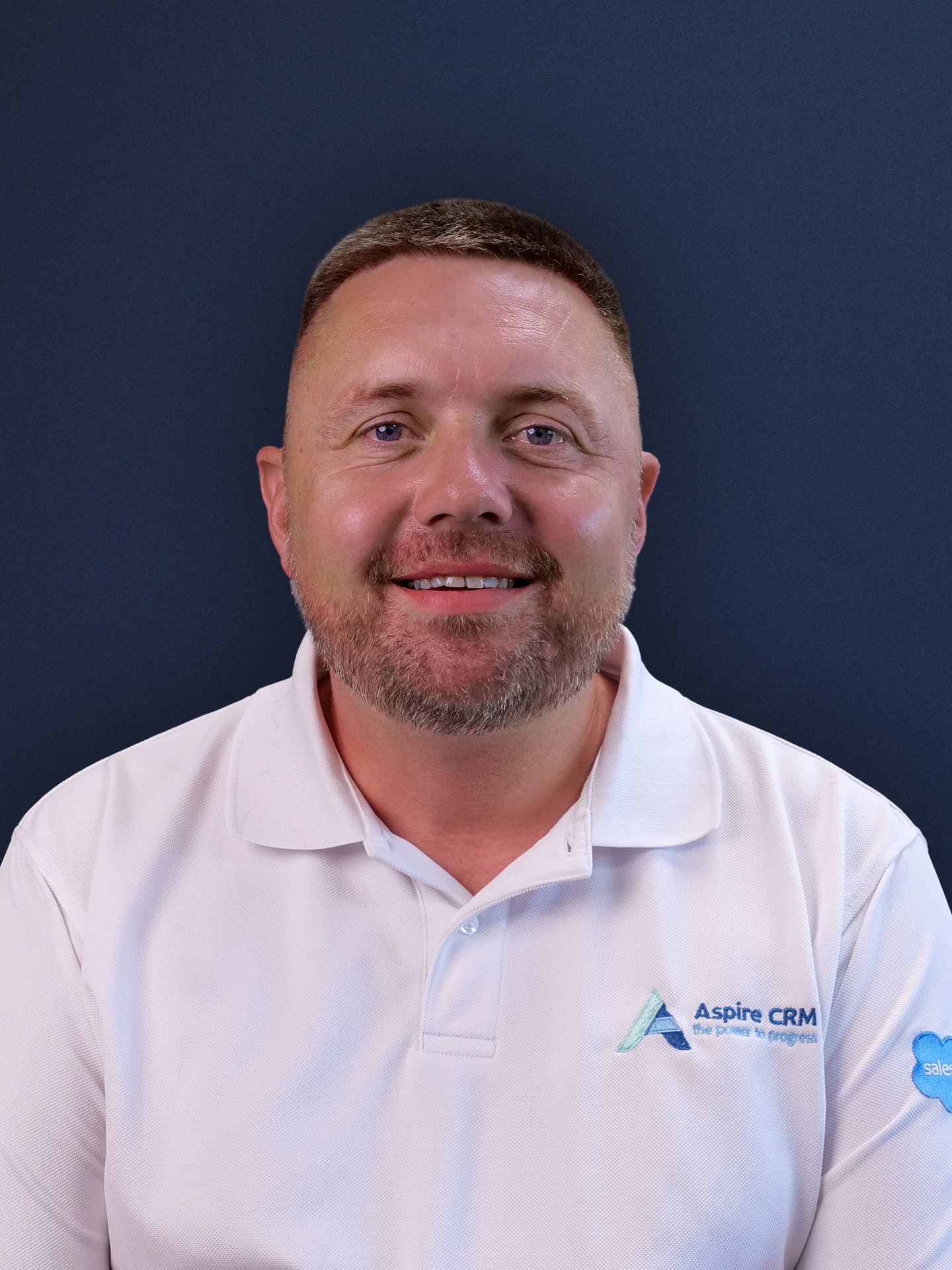 Aspire CRM employee headshot in branded clothing Aspire CRM employee headshot in branded clothing