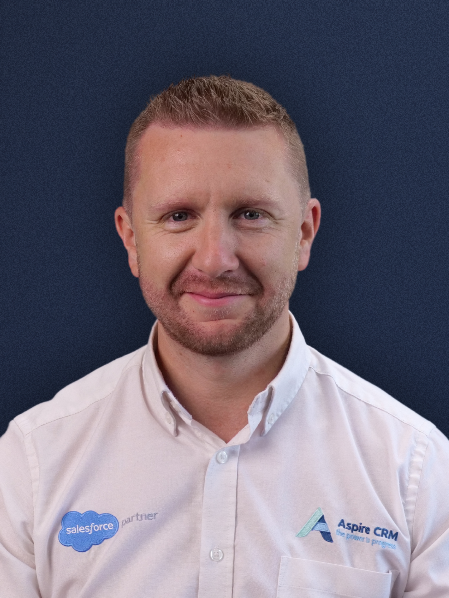 Aspire CRM employee headshot in branded clothing Aspire CRM employee headshot in branded clothing