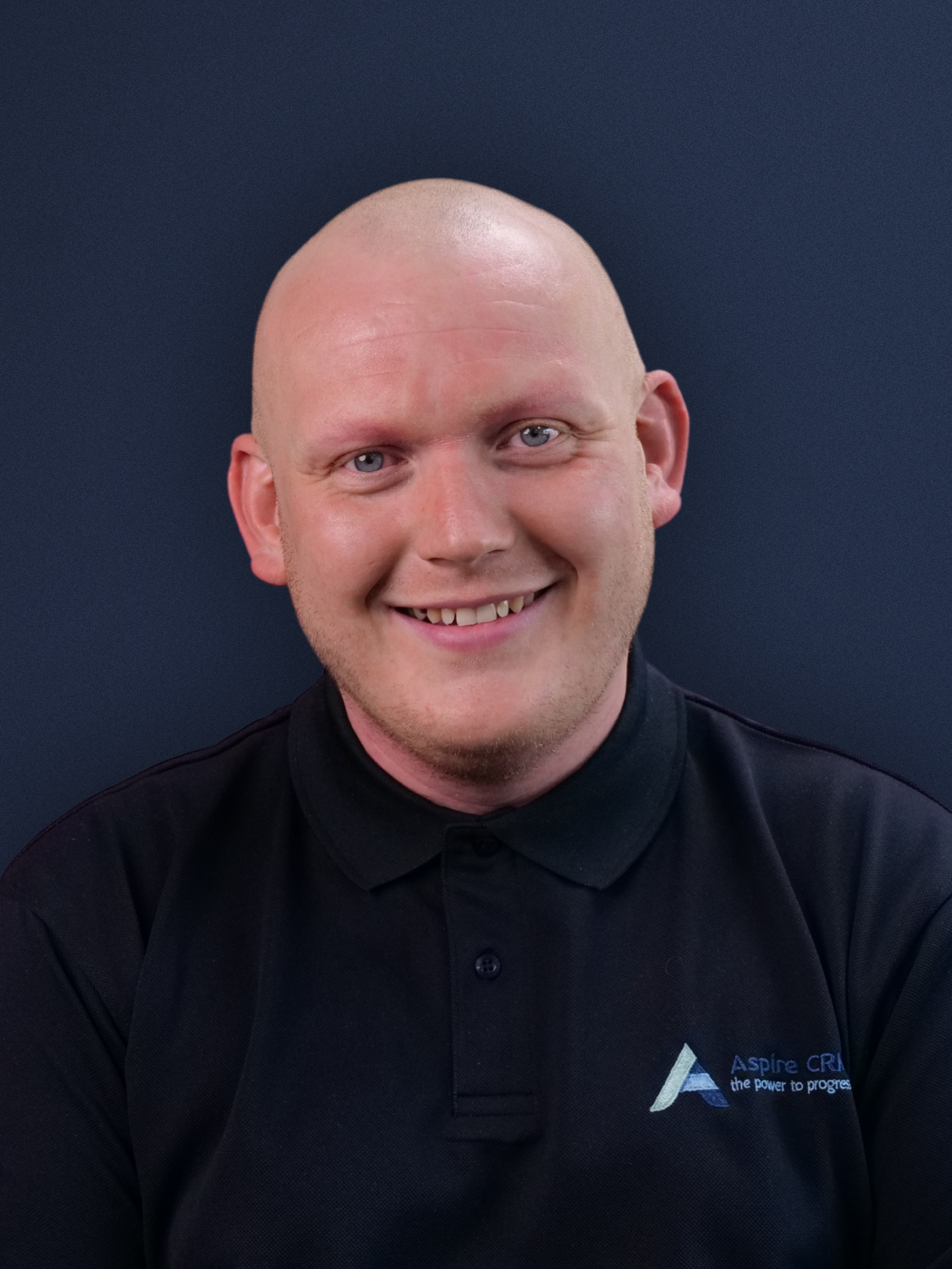 Aspire CRM employee headshot in branded clothing Aspire CRM employee headshot in branded clothing