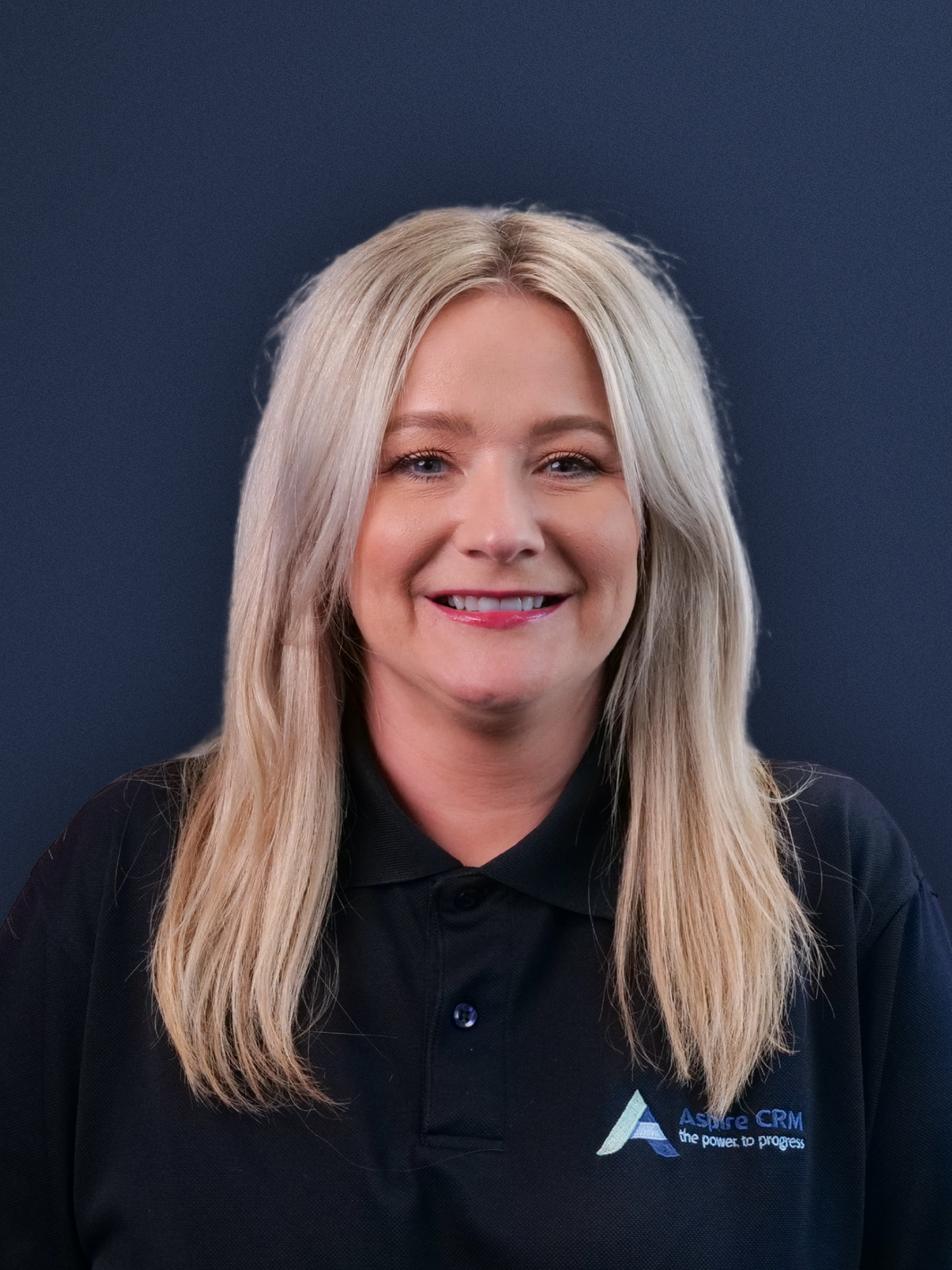 Aspire CRM employee headshot in branded clothing Aspire CRM employee headshot in branded clothing
